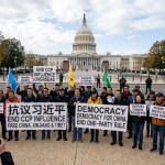 Protesters outside the U.S. Capitol hold signs reading “FREE CHINA, XINJIANG & TIBET,” “DEMOCRACY FOR CHINA, END ONE-PARTY RULE,” “DICTATOR XI JINPING NOT WELCOME,” “SUPPORT CHINESE DISSIDENTS,” and “HUMAN RIGHTS CHINA NOW.”